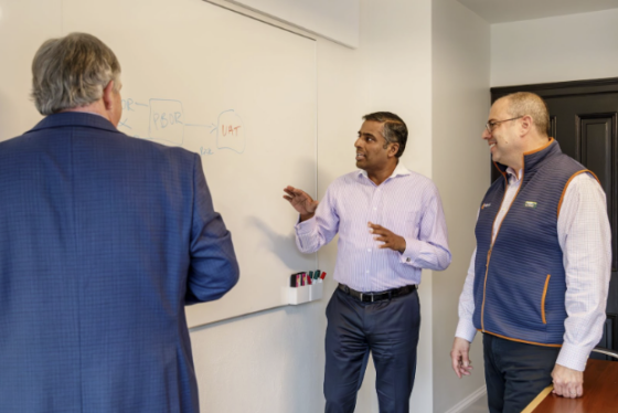Meradia team members completing a white boarding session.